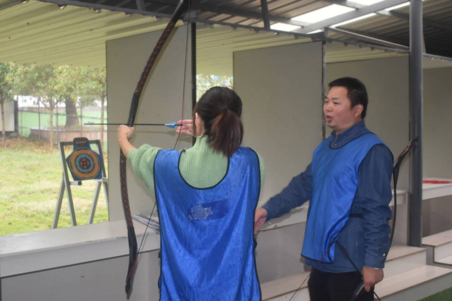 Teams practice archery together.jpg